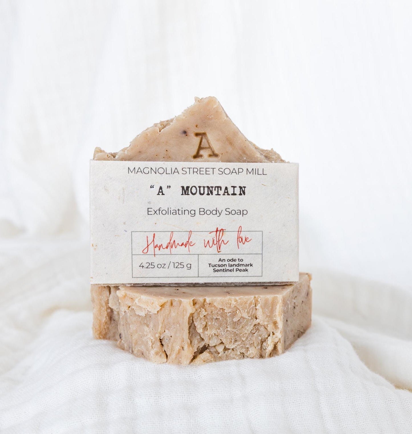 Stacked "A" Mountain / Sentinel Peak bars with white cloth background. Bar soaps that pay homage to a local tucson landmark.